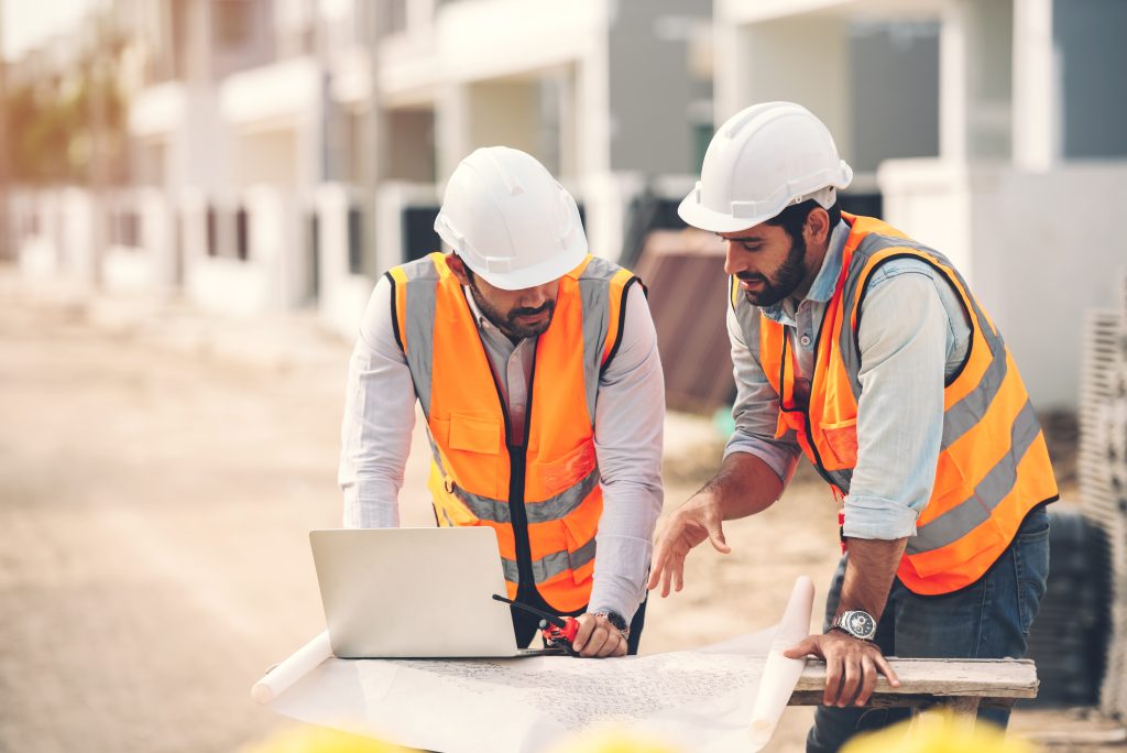Engineers reviewing plans – Lydney Pallets and Cases sale to Green Earth Investments