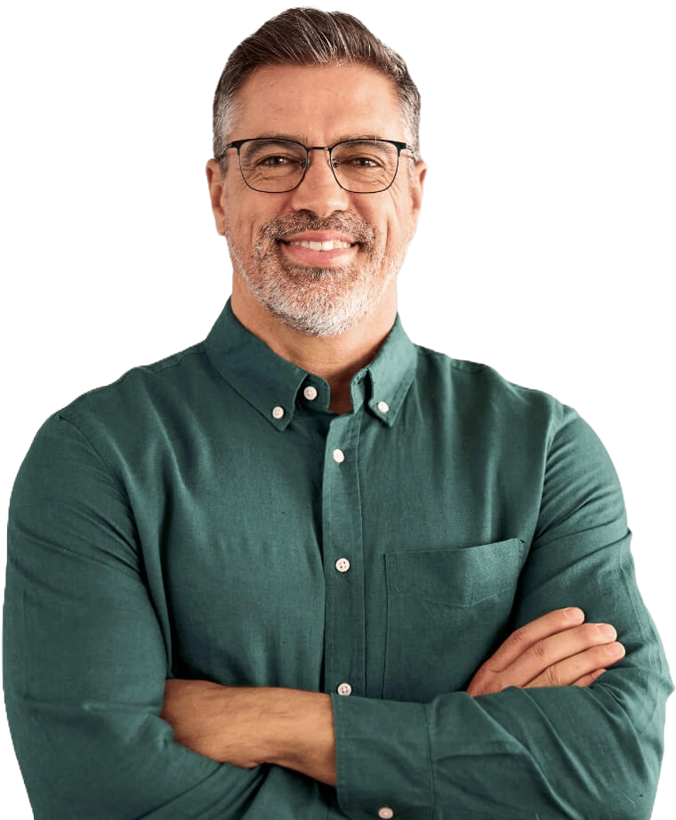 business man with arms folded, wearing a green shirt and glasses